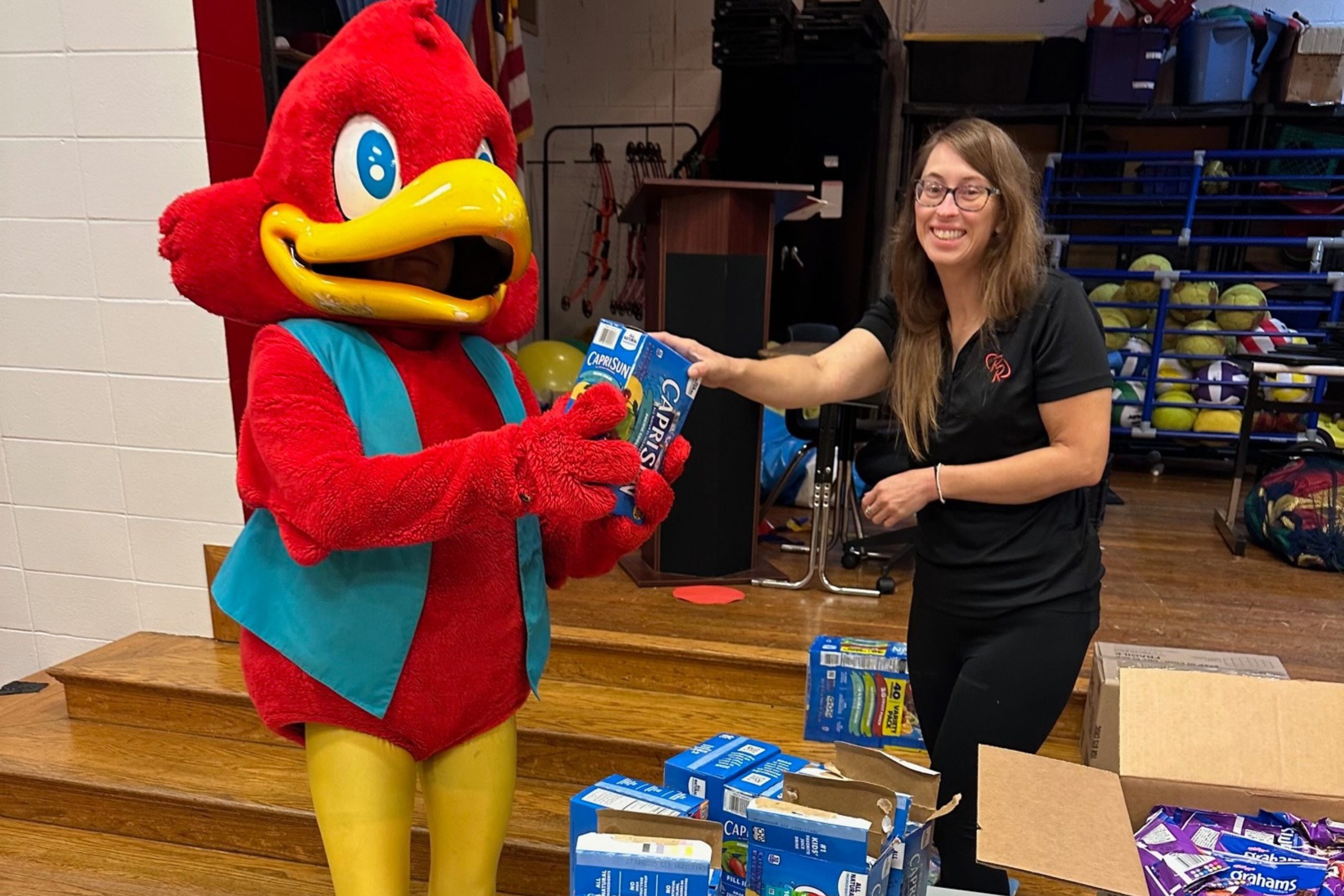 Red Robin mascot volunteering at school